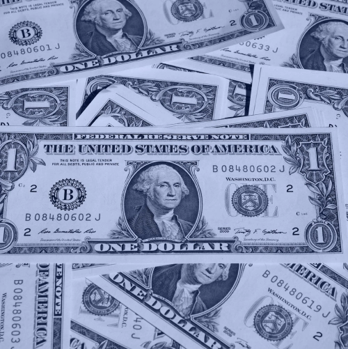 Multiple one-dollar bills spread out